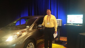 John Knuth displays Itron's Electric Vehicle Charging Station.